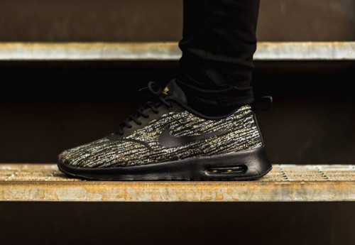 nike thea womens black and gold