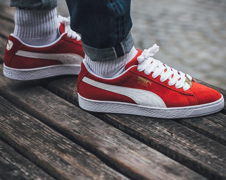 red pumas suede on feet