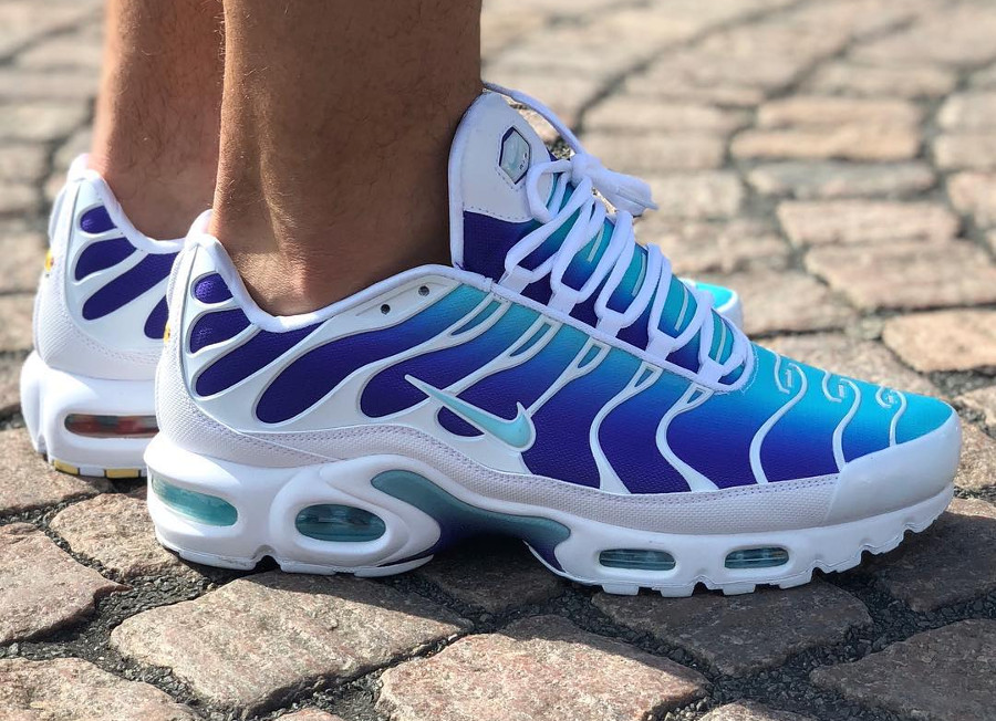 purple and white air max plus