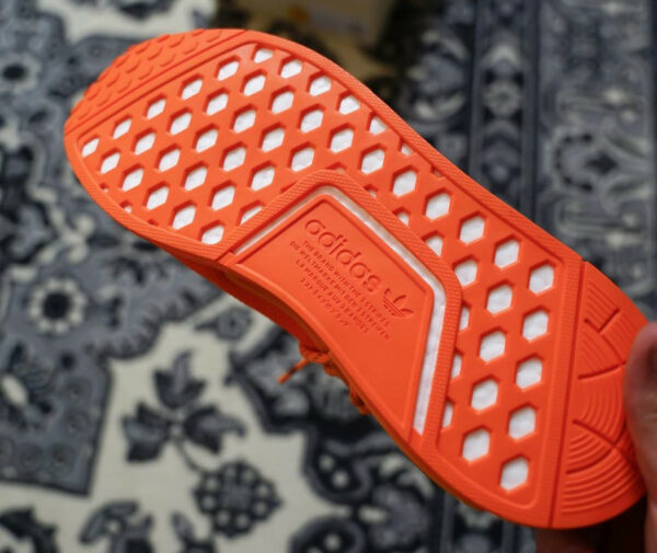 human race nmd orange